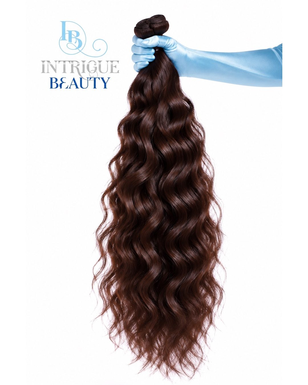 Wavy brown hair bundle held up by a blue satin glove, Intrigue Beauty logo